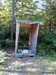 Derelict hunt camp outhouse