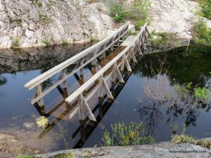 The submerged bridge across the creek feeding Lumsden Lake